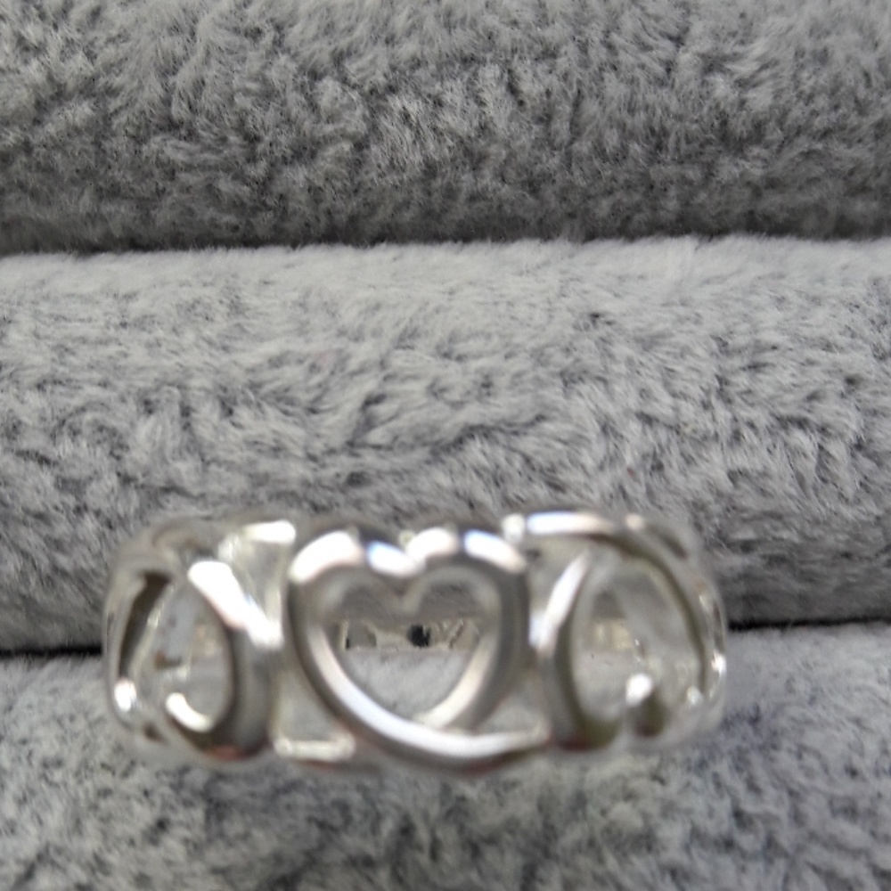 Sliver open work three heart ring